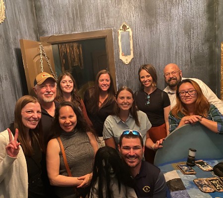 Internal Communications team escapes the escape room successfully and poses for a group photo
